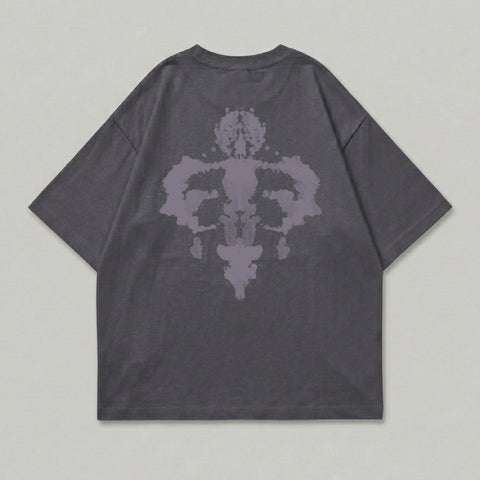 Dark grey t-shirt with symmetrical purple ink-blot design on back.