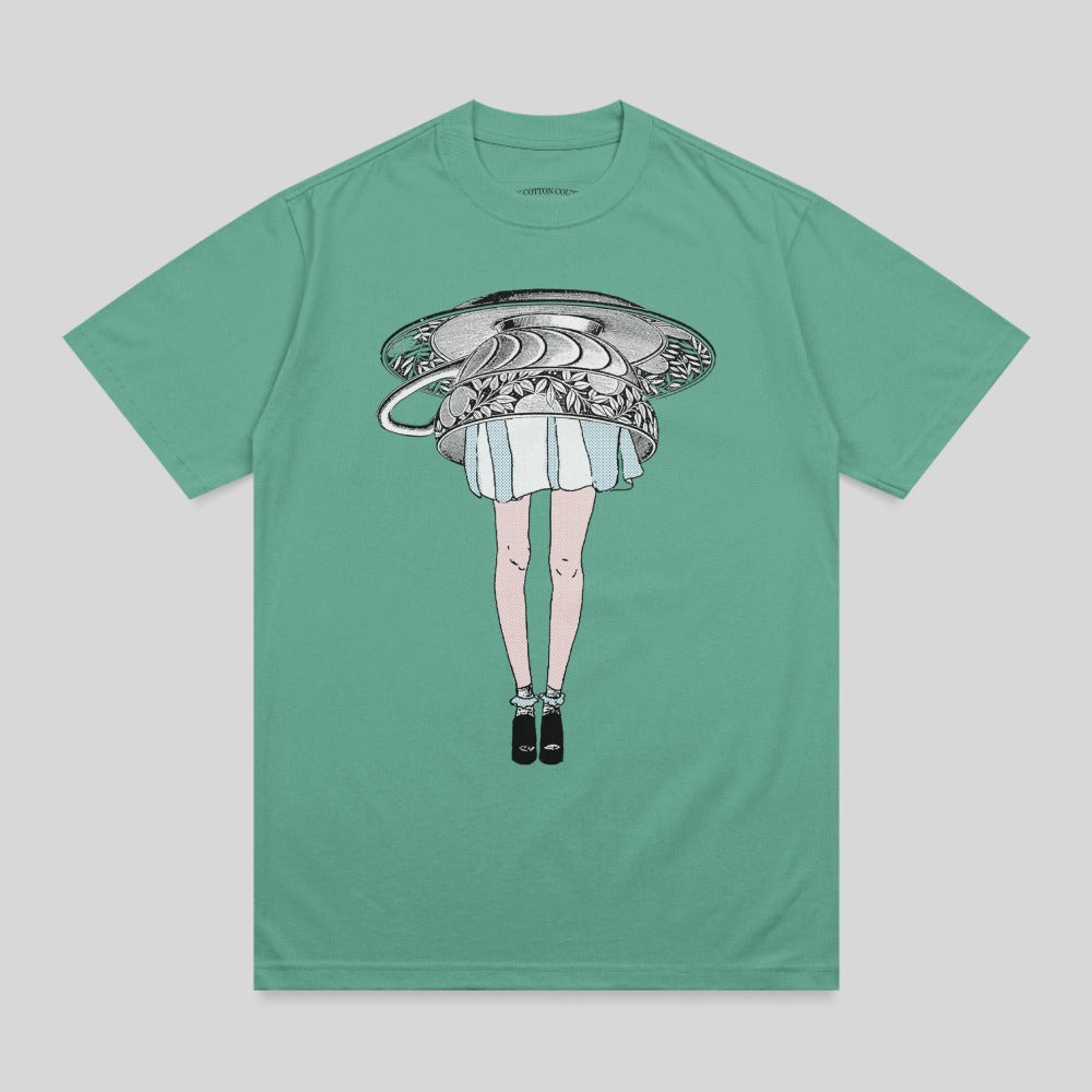 T-shirt graphic of a woman's legs emerging from an overturned teacup.