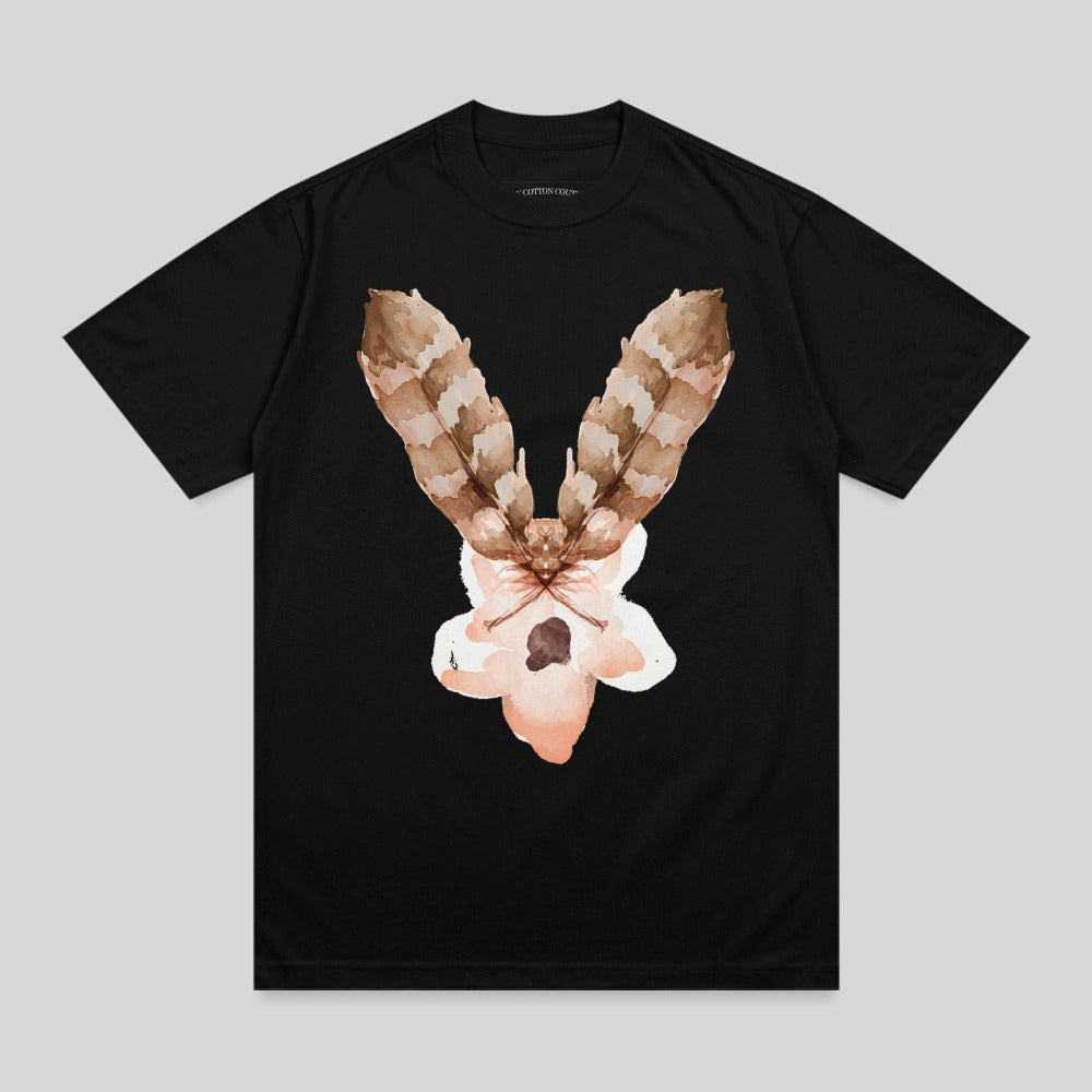 Black t-shirt with a light pink and brown feather moth watercolor graphic.