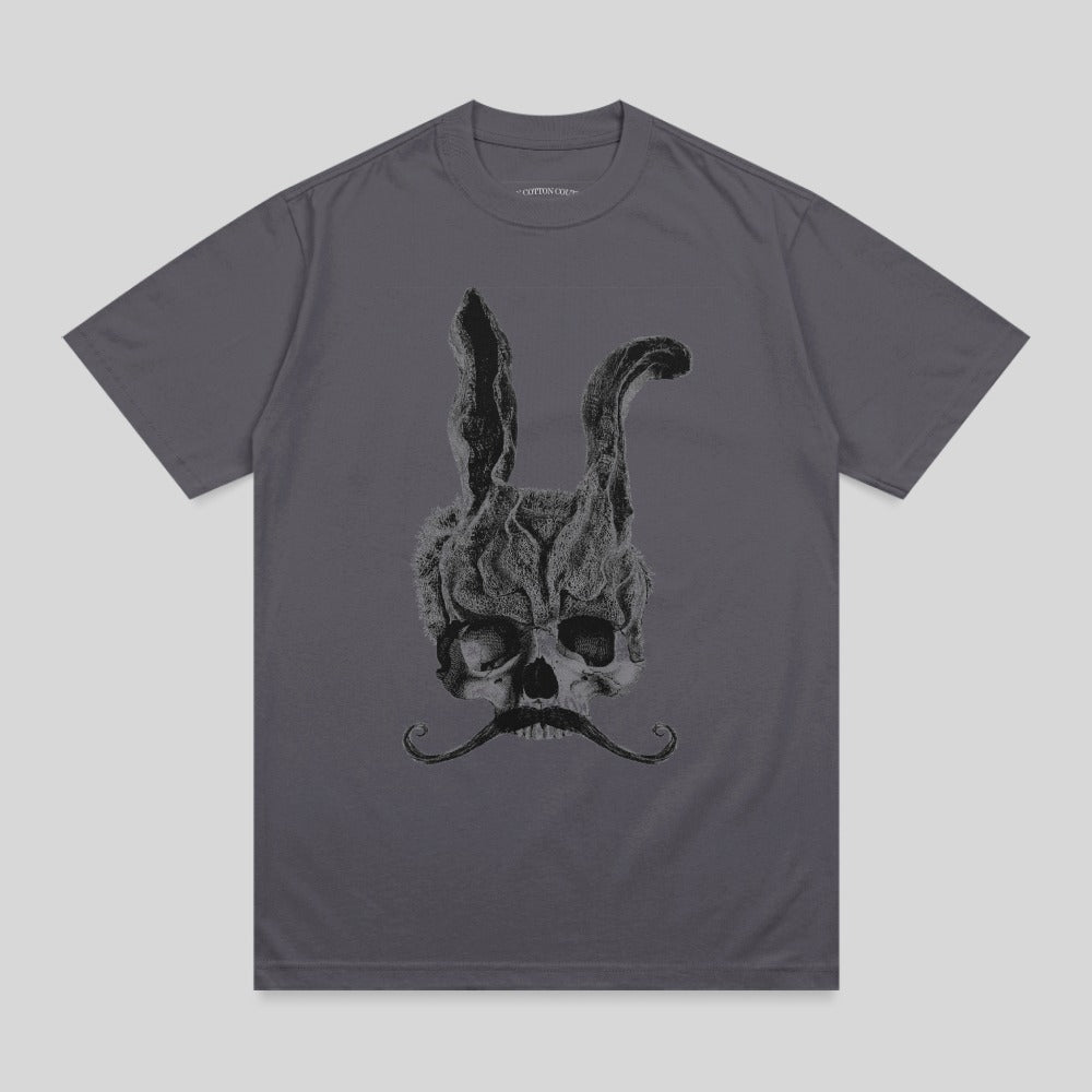 Skull with rabbit ears and mustache, smoke rising from head.