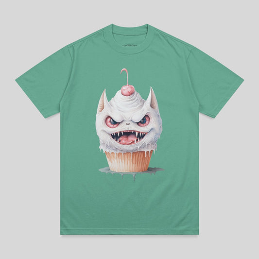 Monster cupcake with cherry on top, illustrated on a teal t-shirt.