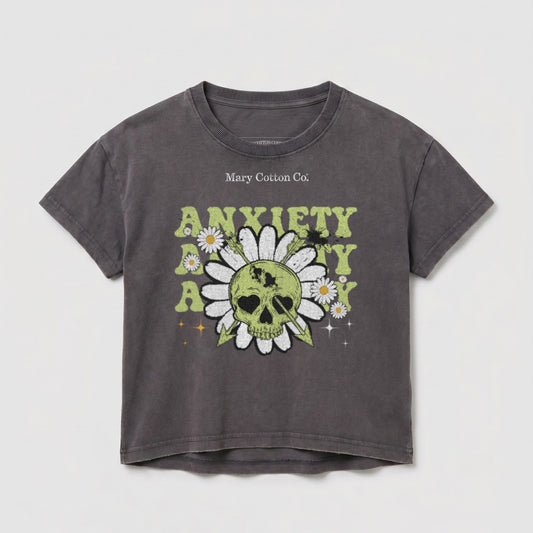 Dark grey t-shirt with skull, daisies, and "Anxiety Kills" text graphic.
