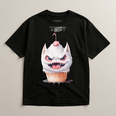 Black t-shirt with a cupcake monster graphic featuring sharp teeth and pink frosting.