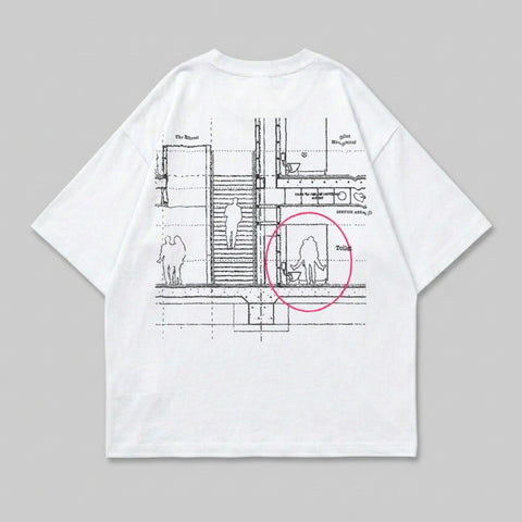 White t-shirt with a blueprint design showing a bathroom and figures.