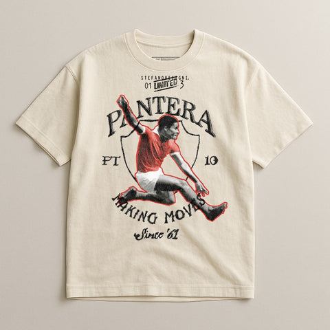 Cream t-shirt with graphic of a soccer player and "PANTERA MAKING MOVES Since '61" text.