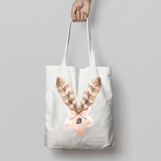 Hand Holding Tote Bag With Artistic Feather Design