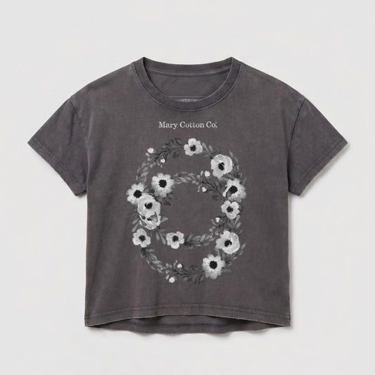 Dark grey cropped t-shirt with a floral wreath and "Mary Cotton Co." text.
