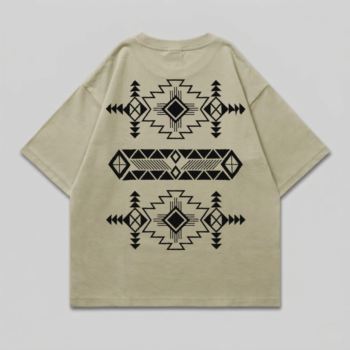 Tan t-shirt with black geometric tribal pattern on back.
