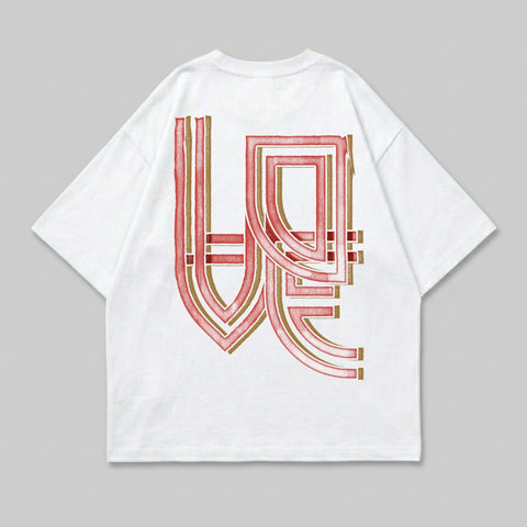 White t-shirt with abstract red and gold graphic design on back.
