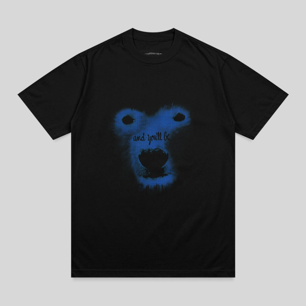 Black t-shirt with a blue abstract bear face and "and you'll be" text.