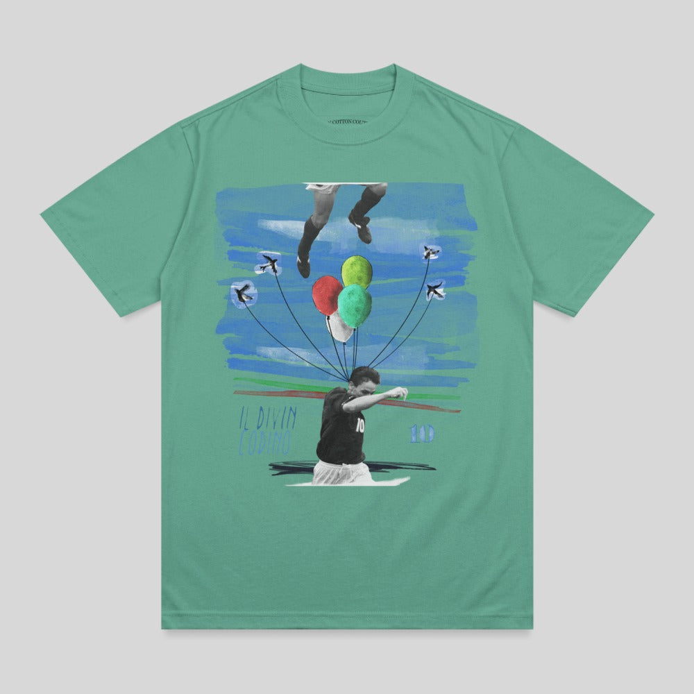 Green t-shirt with graphic of soccer player Lionel Messi with balloons and abstract art.