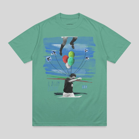 Green t-shirt with graphic of soccer player Lionel Messi with balloons and abstract art.