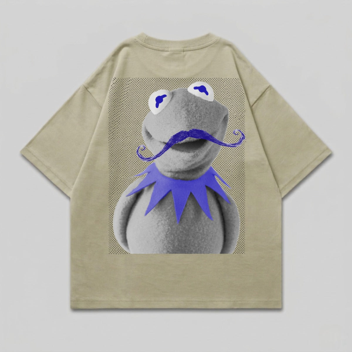 Kermit the Frog wearing a blue mustache and purple collar on a tan t-shirt.