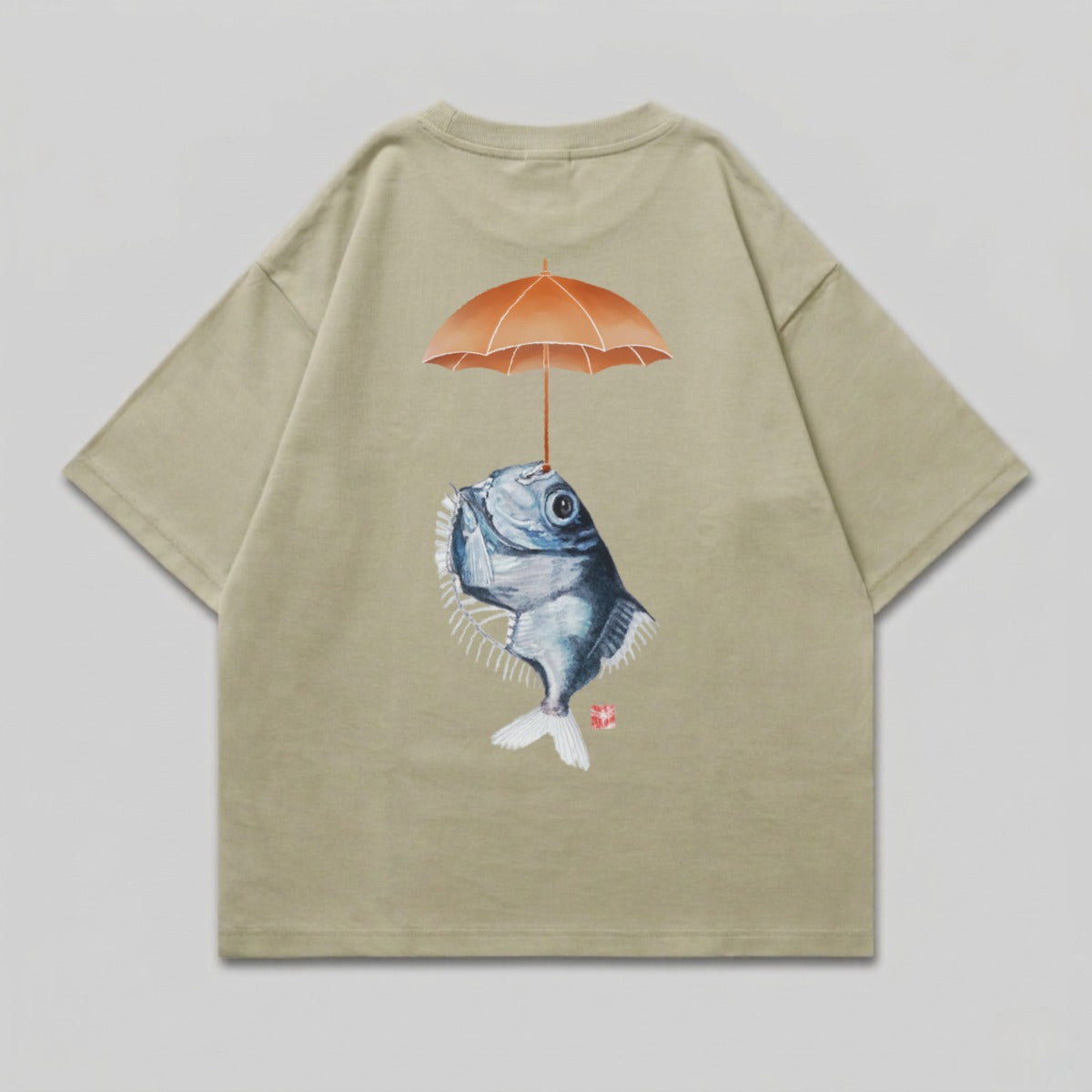 T-shirt with illustration of a fish holding an umbrella over its head.