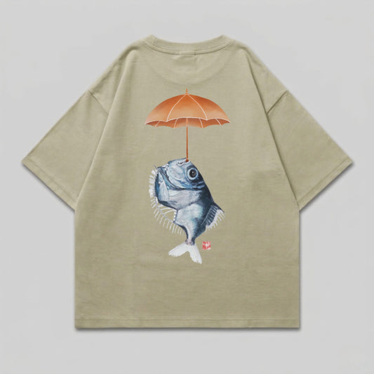T-shirt with illustration of a fish holding an umbrella over its head.