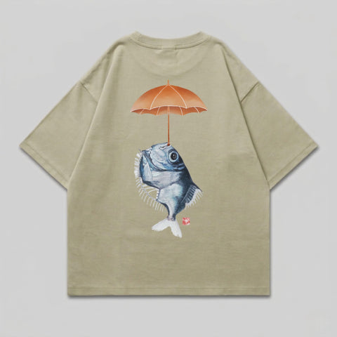 T-shirt with illustration of a fish holding an umbrella over its head.